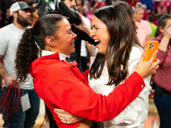 Feb 11, 2024; Lincoln, Nebraska, USA; Nebraska Cornhuskers head coach Amy Williams celebrates with her daughter Kennadi after defeating the Iowa Hawkeyes at Pinnacle Bank Arena.